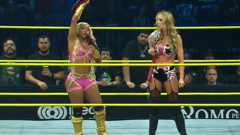 Kiera Hogan and Allie standing in a TNA ring