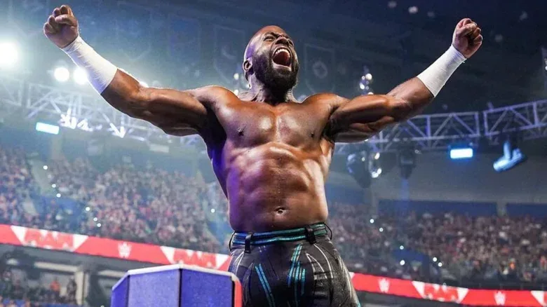 Apollo Crews poses on the ropes before a match on WWE programming.