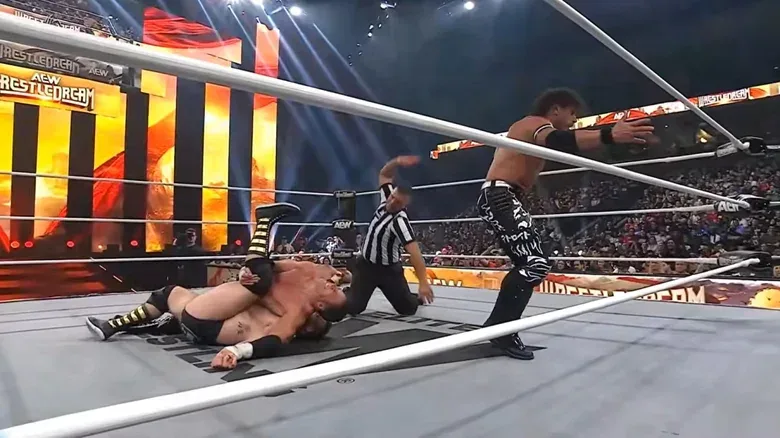 Chris Sabin pins Cash Wheeler while Alex Shelley defends him