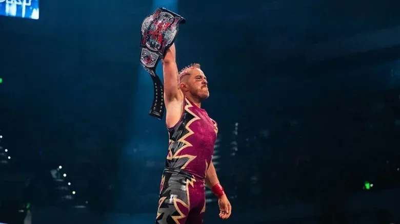 Amazing Red holds up the TNA X-Division Championship after winning the belt in a championship scramble match at TNA Bound for Glory 2026.