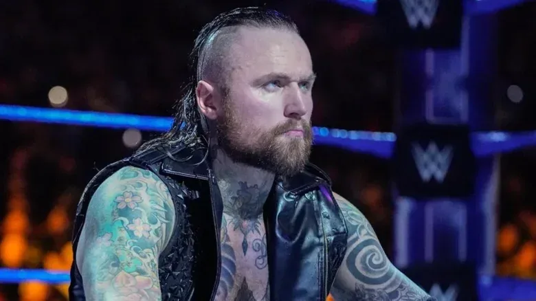 Ex-WWE star Aleister Black sits in the middle of the ring before competing