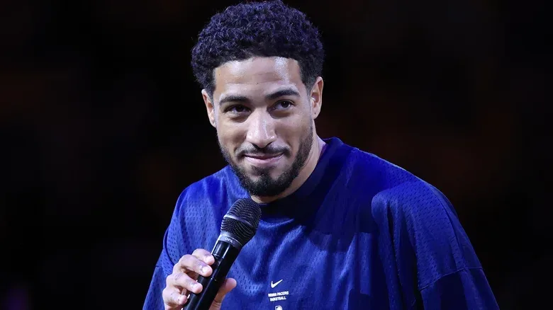 NBA Indiana Pacers guard Tyrese Haliburton makes an announcement on the basketball court