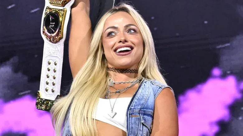 Liv Morgan holding the WWE Women's World Championship