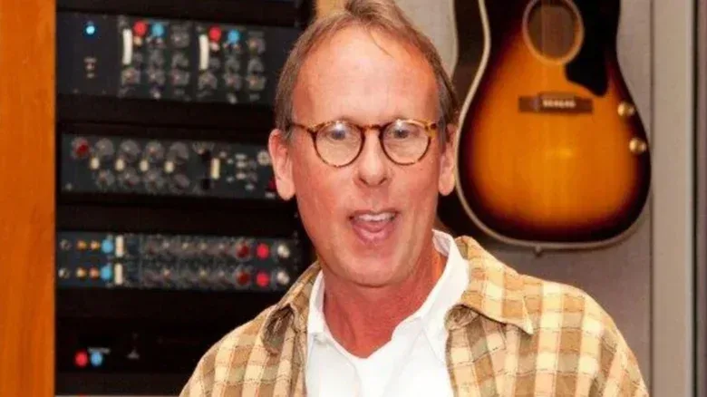 WWE legend and composer Jim Johnston is scene in the studio, guitar behind him, in a photo provided by WWE.