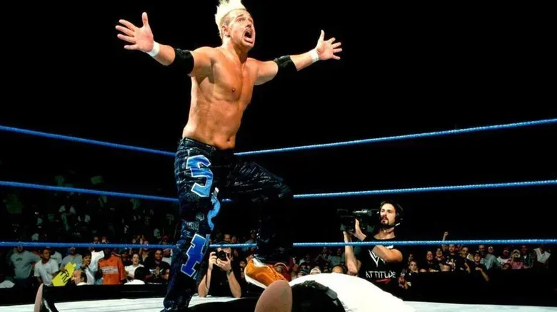 WWE star Scotty 2 Hotty gears up to do The Worm during a match on an edition of "WWE Raw."