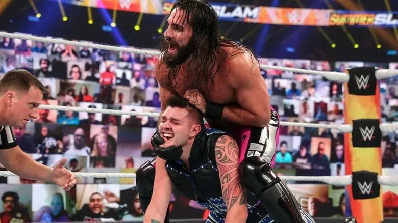 Seth Rollins puts Dominik Mysterio in a hold in the middle of the ring during a match in WWE's "Thunderdome era" in 2020.
