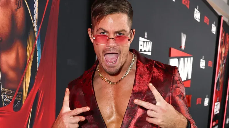 Grayson Waller wearing red sunglasses