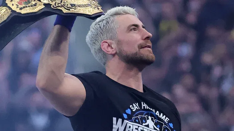 Joe Hendry holding up TNA title at WWE WrestleMania
