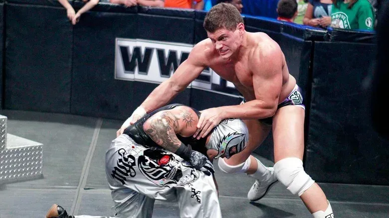 Cody Rhodes and Rey Mysterio clashing during a "SmackDown" match.
