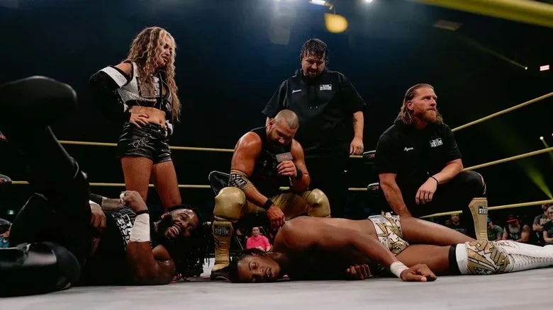 The System standing over Ricky Sosa on TNA Impact