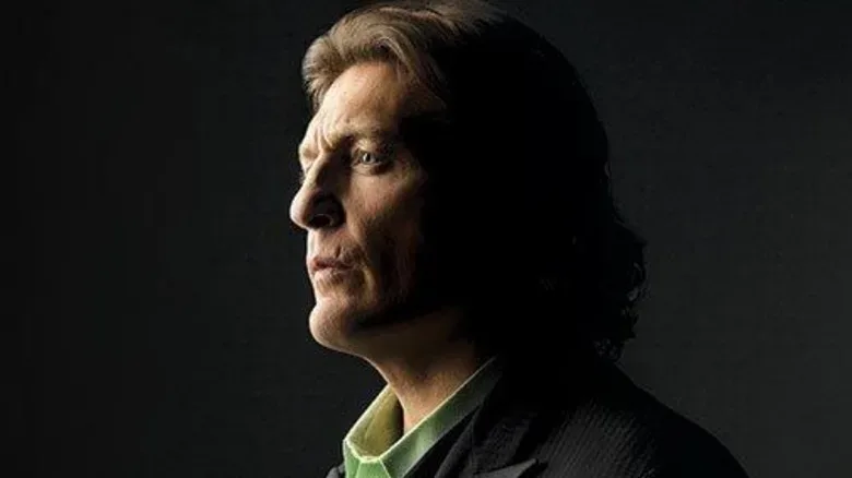 William Regal poses in a WWE photoshoot