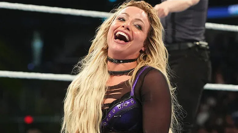 Liv Morgan celebrating with the Women's World Championship after winning it at Money in the Bank 2026.